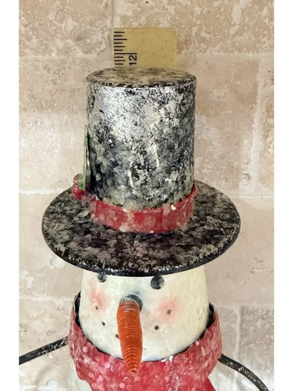 Folk-art metal cone snowman top hat, scarf, wire arms, red jingle bell buttons.